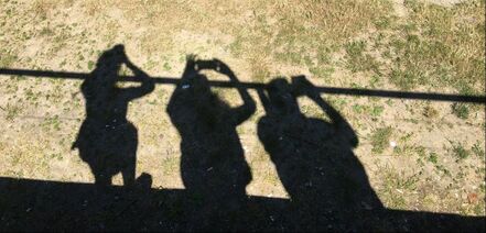 Photo of shadow of 3 of us on bridge each taking a photo.